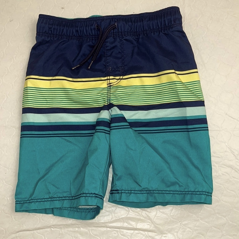 Old Navy striped swim trunks in Save The Teals navy blue yellow teal blue
